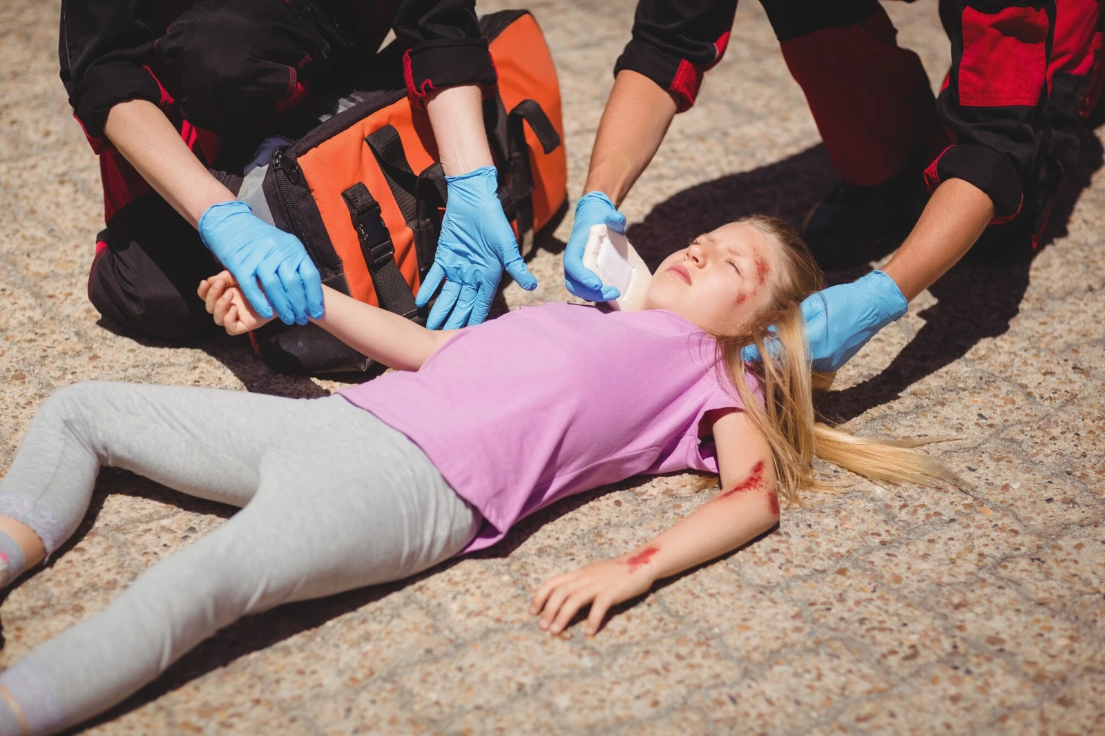 A cyclist receiving treatment after a collision