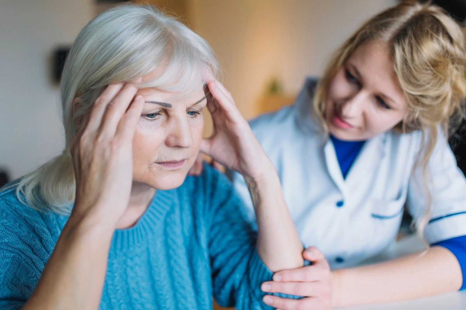 A patient describing symptoms to a doctor