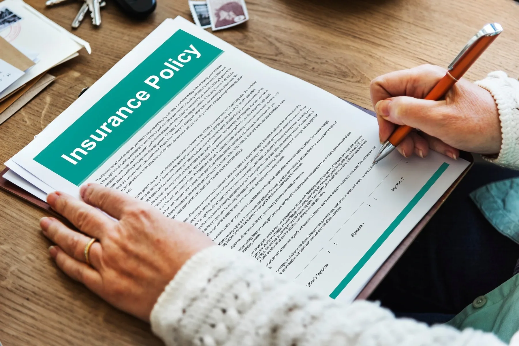 An insurance adjuster reviewing accident paperwork
