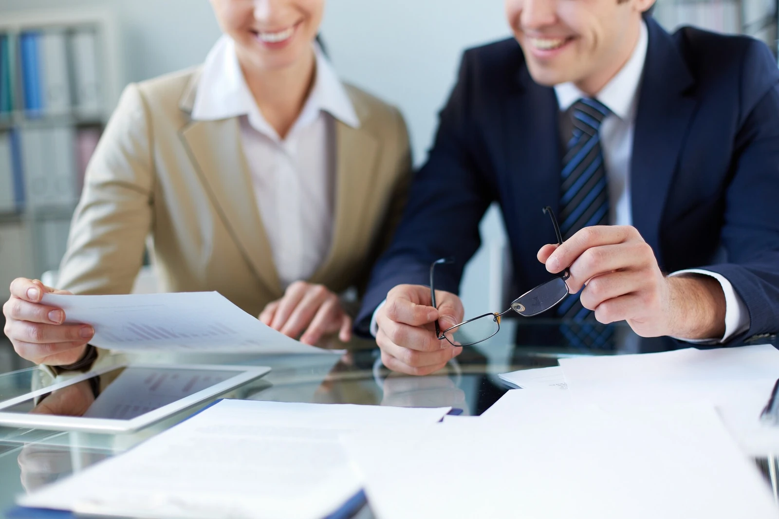 An insurance advisor reviewing a policy with clients